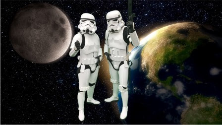 Two storm troopers pose in front of the Earth seen from space.